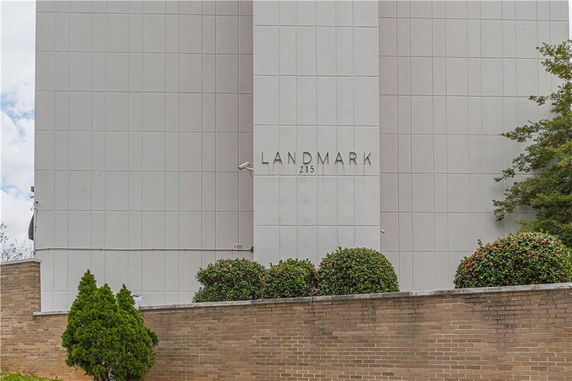 Front view of a building with the name 'Landmark 215' on its facade.