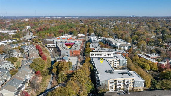 Panoramic view of an urban area with multiple apartment buildings and surrounding landscape.