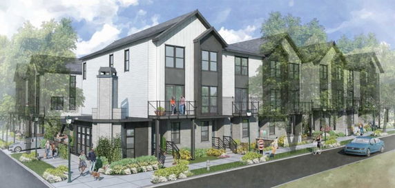 Front view of a modern multi-story residential building with balconies and large windows.