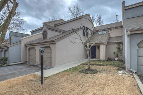 Front view of a multi-story house with a double garage.