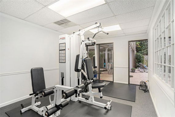 Indoor gym area with exercise equipment.