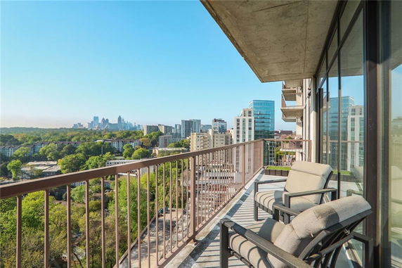 View from a high-rise building balcony overlooking the cityscape.