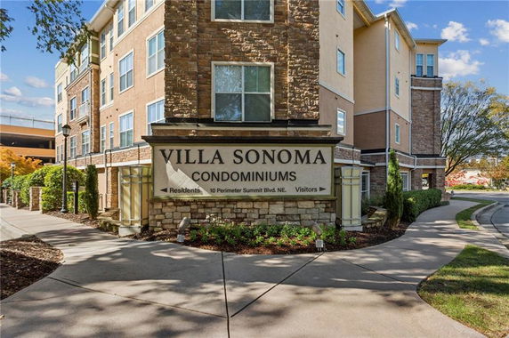 Front view of Villa Sonoma condominiums with a prominent sign in front.