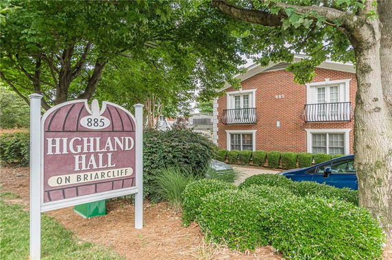 Front view of a two-story brick building with balconies.