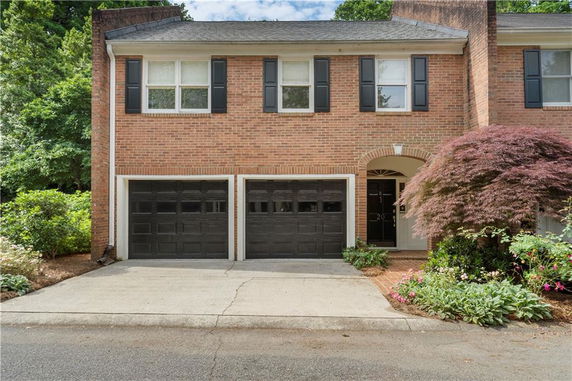 Front view of a two-story house with a double garage.