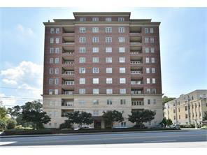 Front view of a multi-story brick apartment building.
