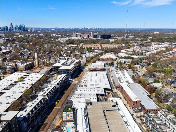 Wide-angle view of a cityscape with numerous buildings in an urban area.