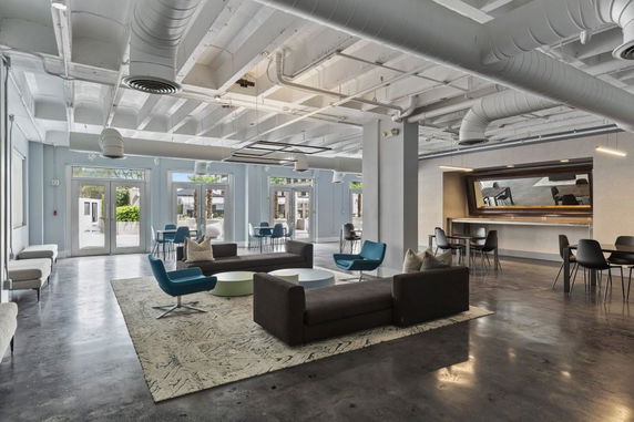 Open and spacious indoor area with seating and a bar counter.