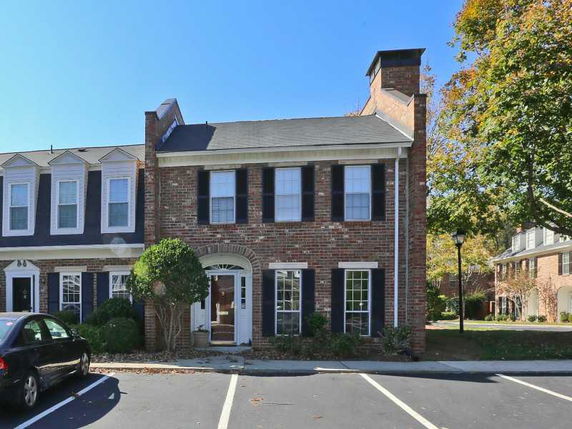 Front view of a two-story brick townhouse.