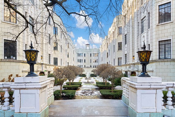 Front view of a multi-story building with classical architectural details.