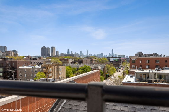 View of a cityscape with buildings and skyline in the background.