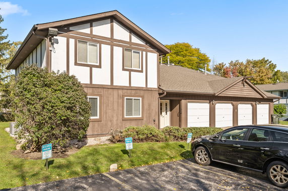 Front view of a two-story house with a triple garage.