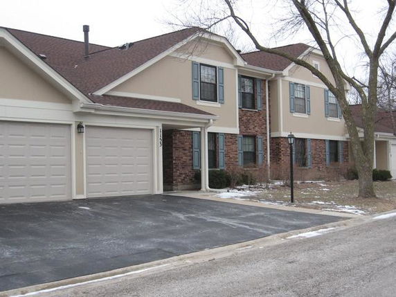 Front view of a two-story house with a two-car garage.