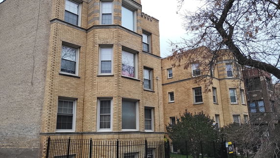Front view of a multi-story brick building.