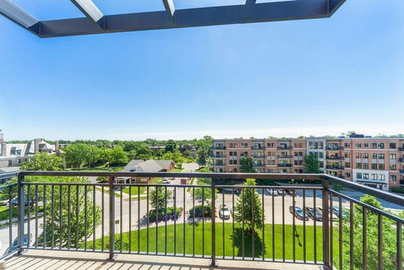 Panoramic view from a balcony overlooking a residential area.