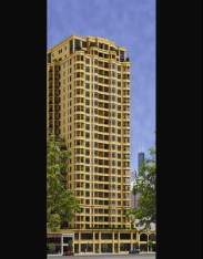 Front view of a tall residential building with multiple floors.