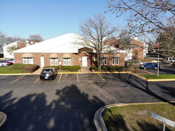 Front view of a single-story building with brick exterior.