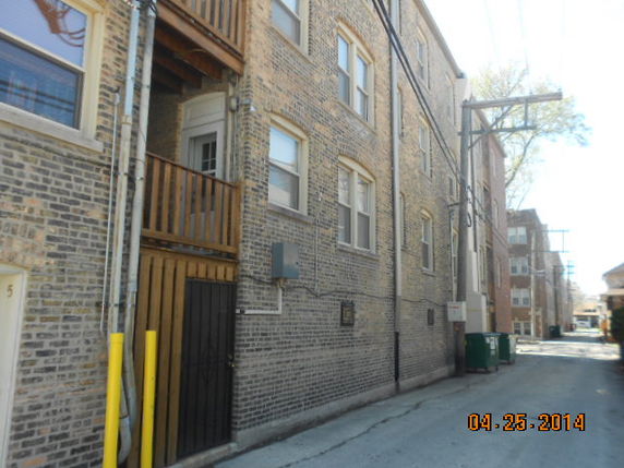 Side view of a multi-story brick building.
