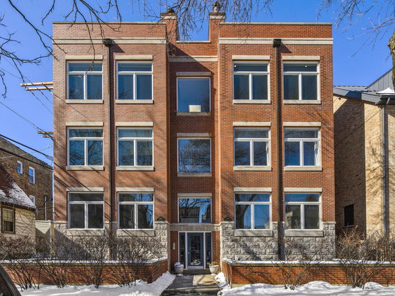 Front view of a multi-story brick building.