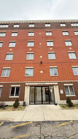 Front view of a multi-story brick building.
