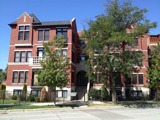 Front view of a multi-story brick building.