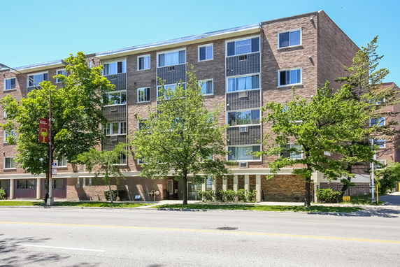 Front view of a multi-story brick building.