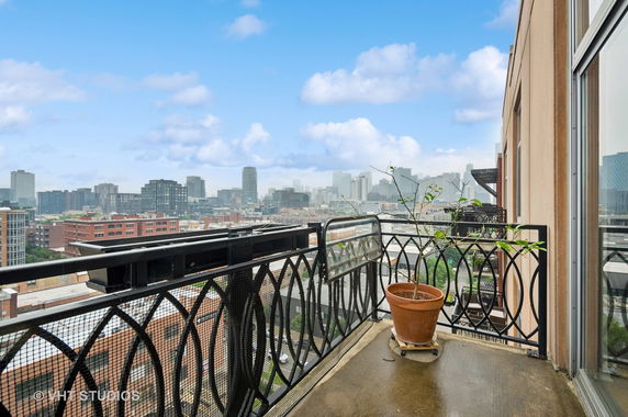 View of surrounding cityscape from a balcony.