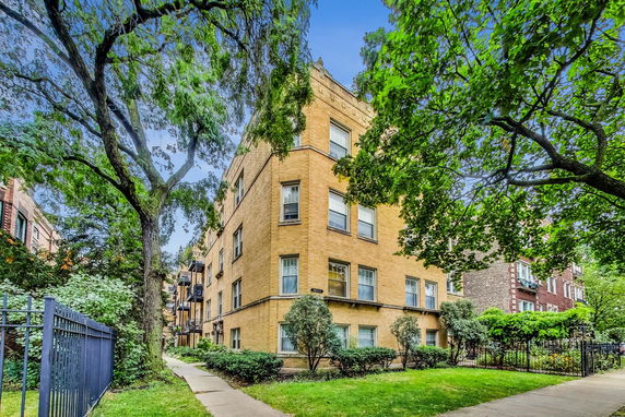Front view of a multi-story brick apartment building