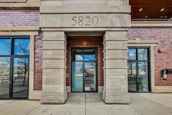 Front view of a building entrance with the number 5820 above the door.