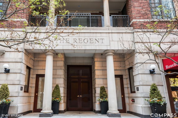 Front view of a building with columns and a sign reading 'The Regent'.