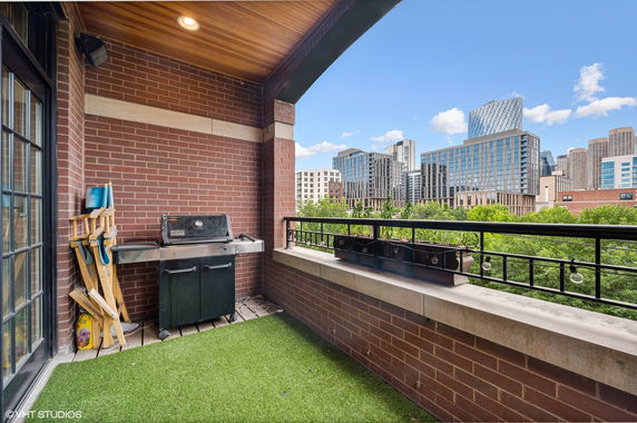 Balcony with a view of city buildings in the background
