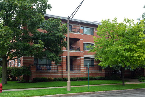 Front view of a three-story brick building.