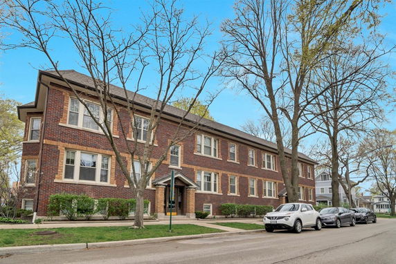 Front view of a two-story brick apartment building.