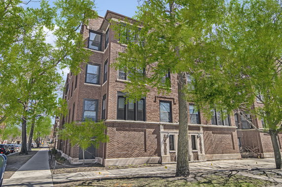 Front view of a multi-story brick building.