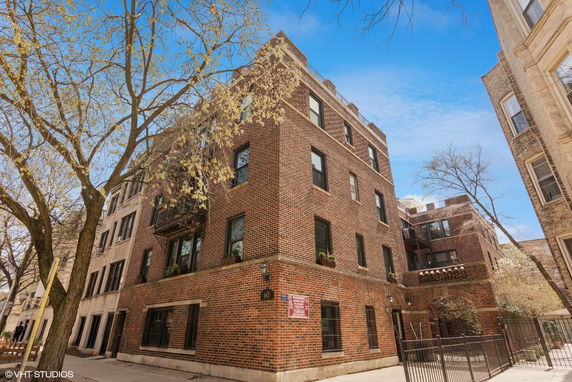 Front view of a multi-story brick building.