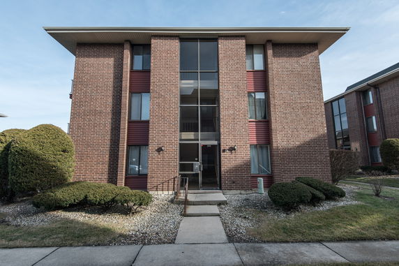 Front view of a multi-story brick building