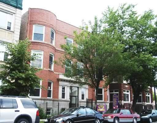 Front view of a three-story brick building.