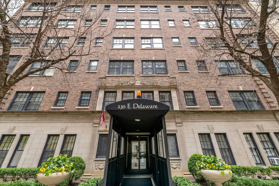 Front view of a multi-story brick residential building.