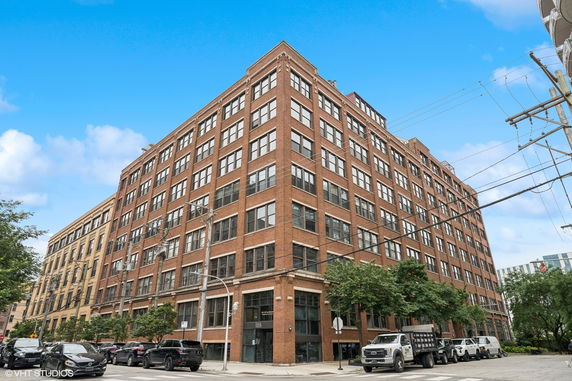 Front view of a large multi-story brick building