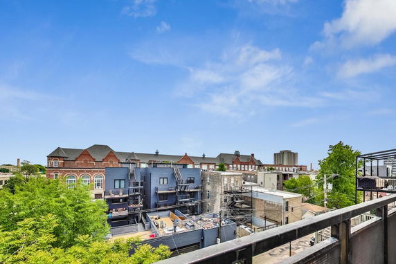 Panoramic view of urban buildings with a clear sky.