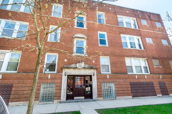 Front view of a multi-story brick building.