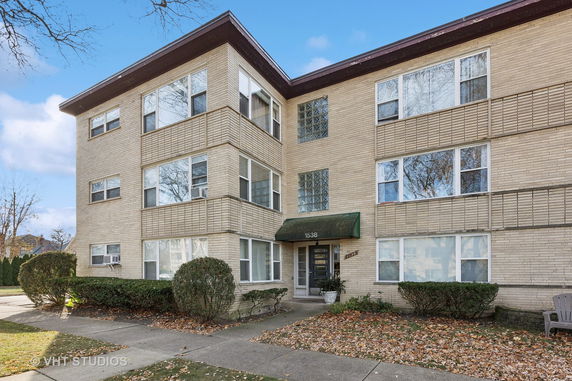 Front view of a three-story apartment building.