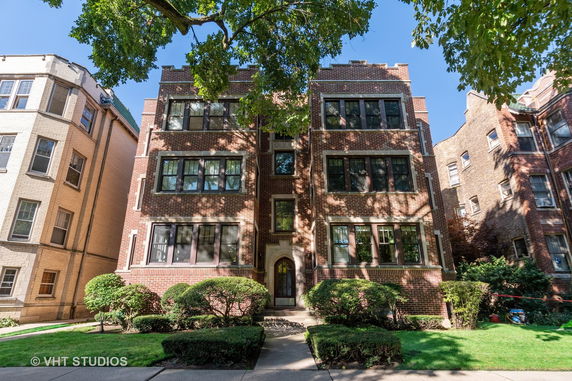 Front view of a multi-story brick apartment building