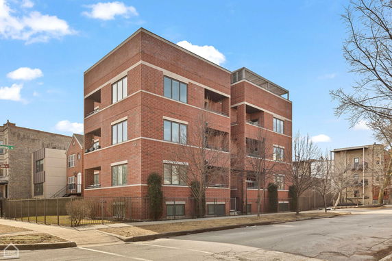 Front view of a multi-story brick building.