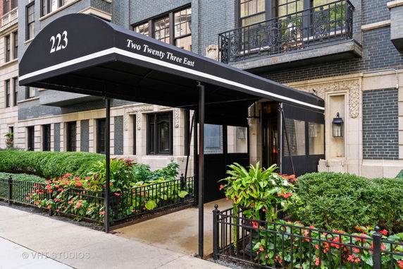 Front view of a building with an entrance canopy labeled 'Two Twenty Three East'.