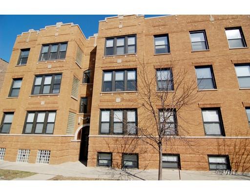 Front view of a multi-story brick apartment building.