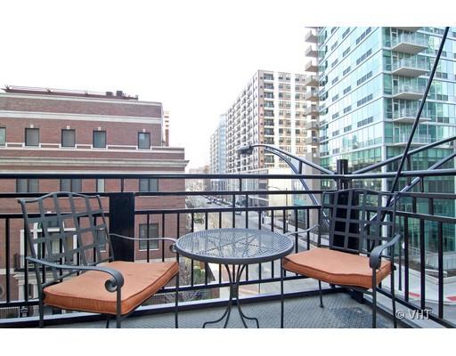 View from a balcony showing surrounding tall buildings.