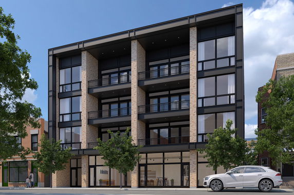 Front view of a modern multi-story building with large windows and balconies.