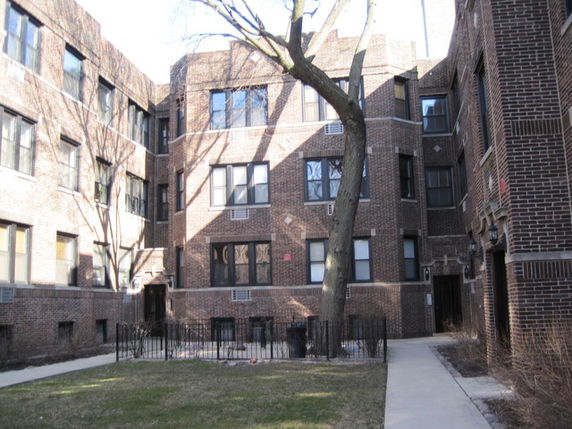 Front view of a multi-story brick apartment building