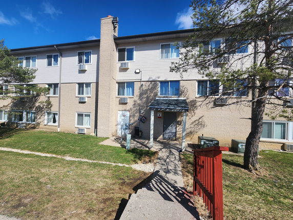 Front view of a three-story apartment building.